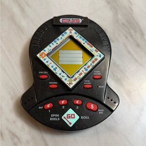 Monopoly hand held game sound and game works AA 2 batteries